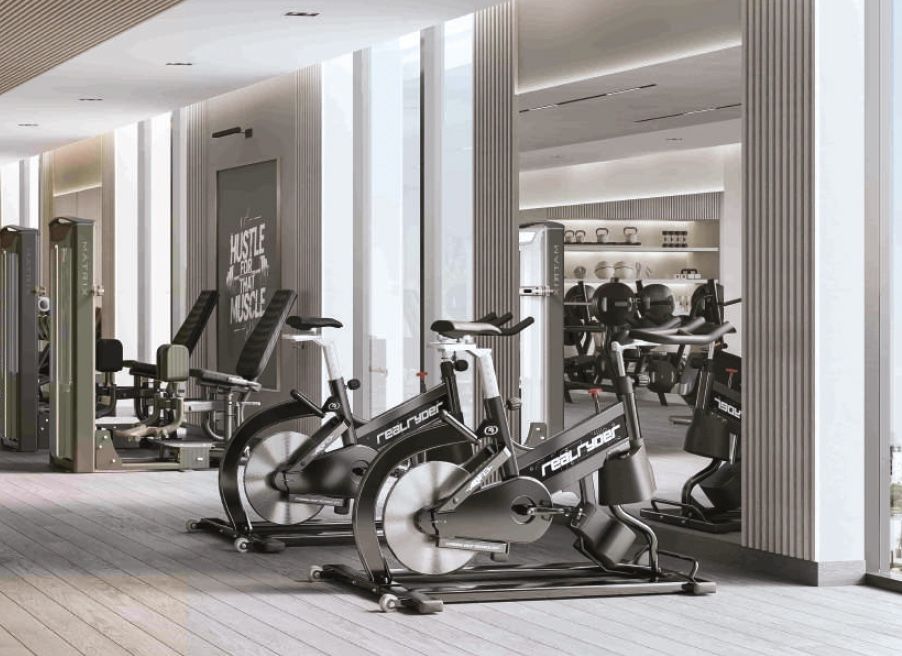 Gym cycling and strength area, Al Ameera Village brochure image