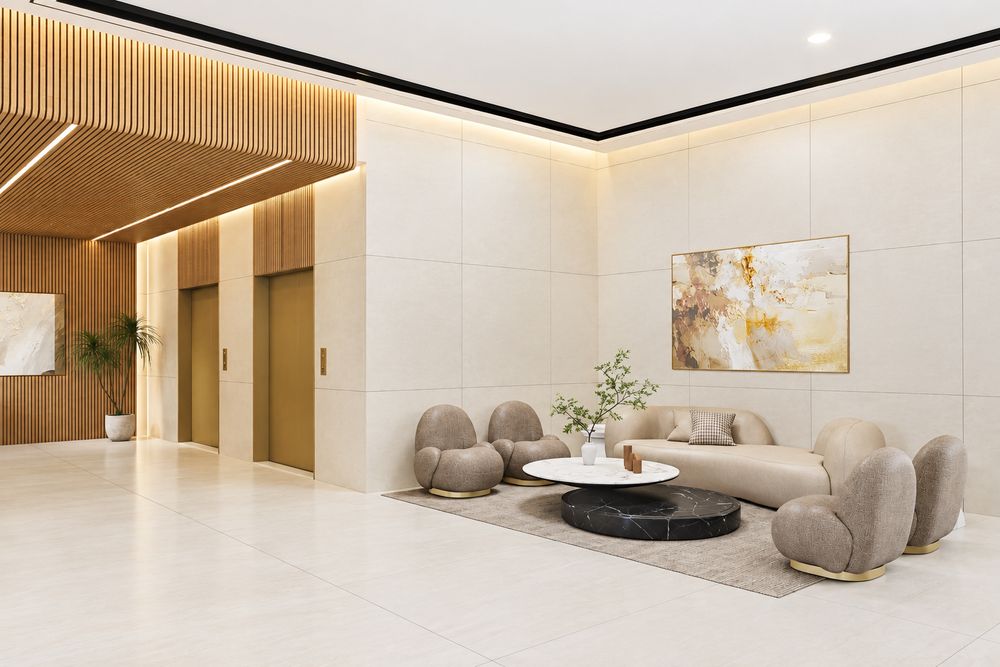 Illustrative lobby lounge with seating and lifts, Al Ameera Village